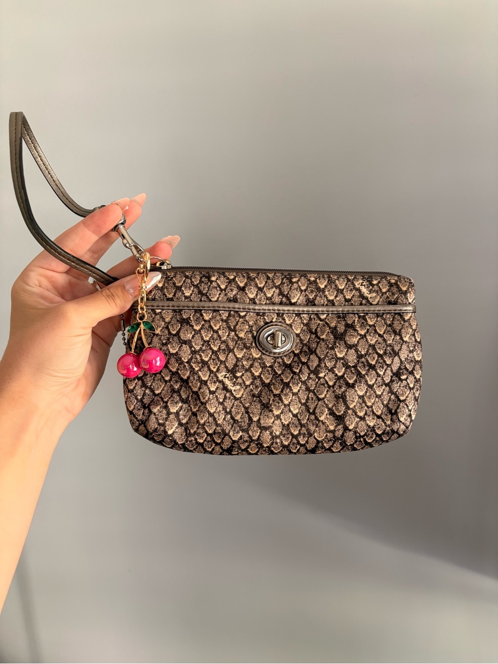 Coach Y2K Legacy Turnlock Wristlet in snakeskin with Cherry Bag Charm